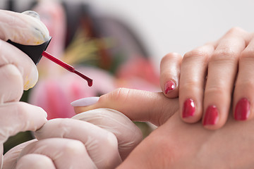 Image showing Woman hands receiving a manicure