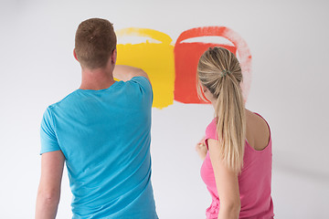 Image showing couple painting interior wall