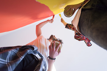 Image showing couple painting interior wall