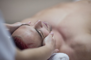 Image showing man receiving a head massage