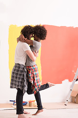 Image showing Young happy multiethnic couple hugging