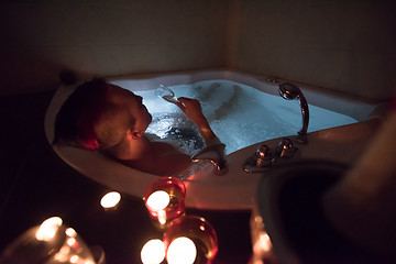 Image showing man relaxing in the jacuzzi