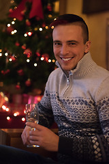 Image showing Happy young man with a glass of champagne