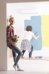 Image showing happy young couple doing home renovations