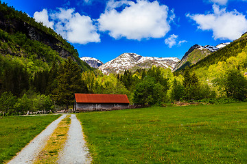 Image showing Beautiful natural landscape with green meadows, snow-capped moun