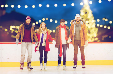 Image showing happy friends on christmas skating rink