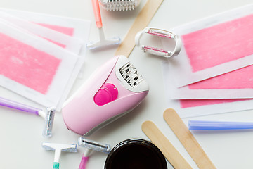 Image showing hair removal wax, epilator and safety razor