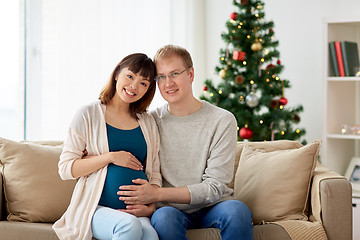 Image showing pregnant wife with husband at home at christmas