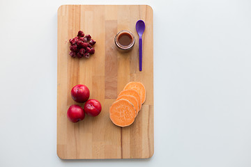 Image showing fruit puree or baby food in jar and feeding spoon