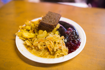 Image showing braised cabbage and sausages with sauce on plate