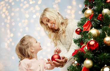 Image showing happy family decorating christmas tree