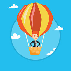 Image showing Young woman flying in hot air balloon.