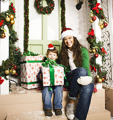 Image showing happy family on Christmas in red hats