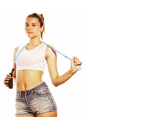 Image showing young pretty woman with skipping rope isolated on white