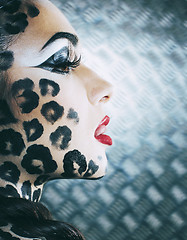 Image showing young sexy woman with leopard make up all over body, cat bodyart