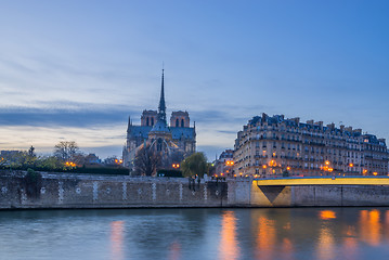 Image showing Notre Dame Cathedral with Paris cityscape at dus