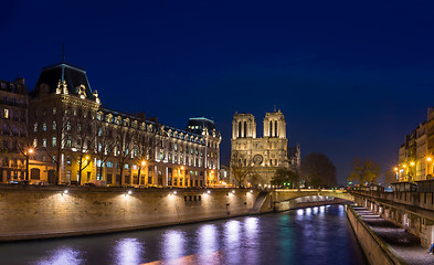 Image showing Bridge by the Seine river in Paris at night