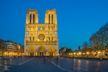 Image showing Notre Dame Cathedral with Paris cityscape at dusk
