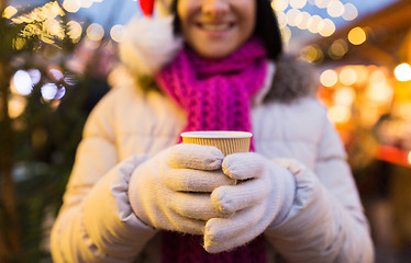 Image showing woman with cup of hot drink at christmas market