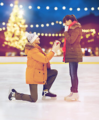 Image showing couple with engagement ring at xmas skating rink