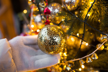 Image showing close up of hand with christmas tree toy