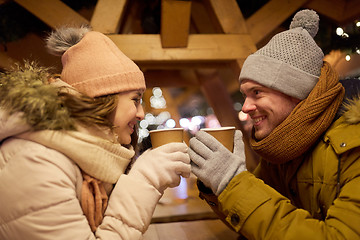 Image showing happy young couple with coffee at christmas market