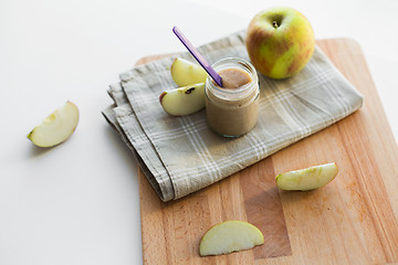 Image showing jar with apple fruit puree or baby food on table