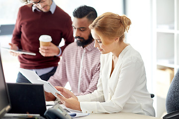 Image showing business team with tablet pc in office