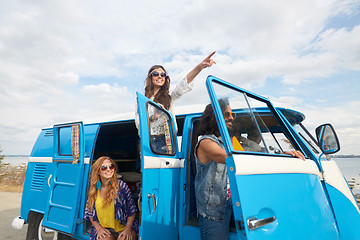 Image showing smiling happy young hippie friends at minivan car