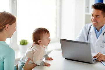 Image showing woman with baby and doctor with laptop at clinic