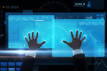 Image showing close up of businessman hands with virtual screen