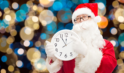 Image showing santa claus with twelve on clock at christmas