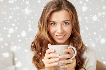 Image showing close up of happy woman with coffee cup at home