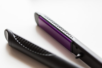 Image showing close up of flat hair straightening iron