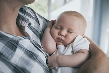 Image showing Father Holding Newborn Baby Son