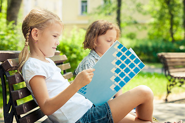 Image showing Two happy children  playing in the park at the day time.