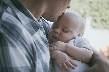 Image showing Father Holding Newborn Baby Son