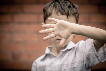 Image showing Portrait of a sad little boy.