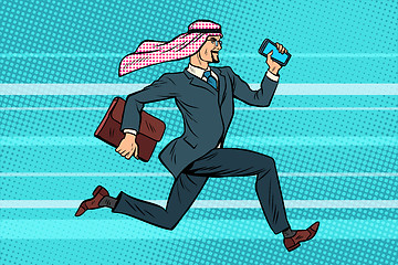 Image showing Arab businessman runs forward, phone and briefcase in hand