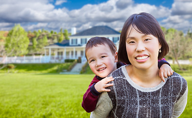 Image showing Chinese Mother and Mixed Race Child In The Front Yard of Custom 