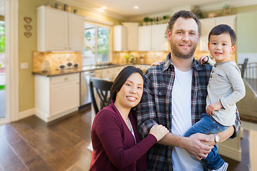 Image showing Mixed Race Chinese and Caucasian Parents and Child Indoors Insid