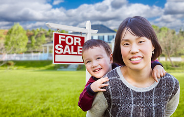 Image showing Chinese Mother and Mixed Race Child In Front of Custom House and