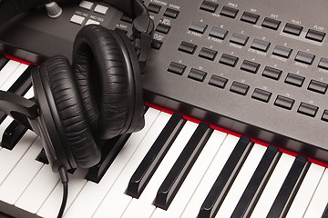 Image showing Listening Headphones Laying on Electronic Synthesizer Keyboard