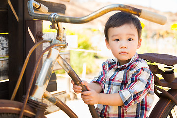 Image showing Mixed Race Caucasian and Chinese Young Boy Having Fun on the Bic