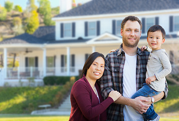 Image showing Mixed Race Chinese and Caucasian Parents and Child In Front Yard