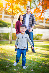 Image showing Outdoor Portrait of Happy Mixed Race Chinese and Caucasian Paren