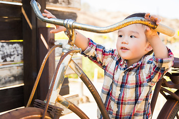 Image showing Mixed Race Caucasian and Chinese Young Boy Having Fun on the Bic