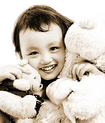 Image showing Cute Young Girl Hugging Two Teddy Bears