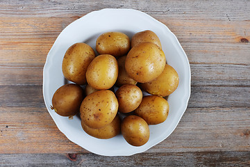 Image showing boiled potatoes in their skins on a plate