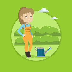 Image showing Farmer with watering can at field.